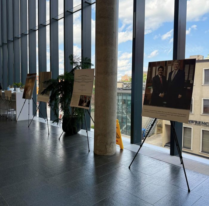 Photographs of Martyr Shahbaz Bhatti displayed on easels at Brampton City Hall.
