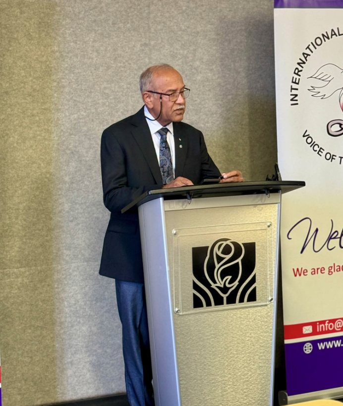 A speaker at the podium during the International Christian Voice Meet & Greet in Brampton.
